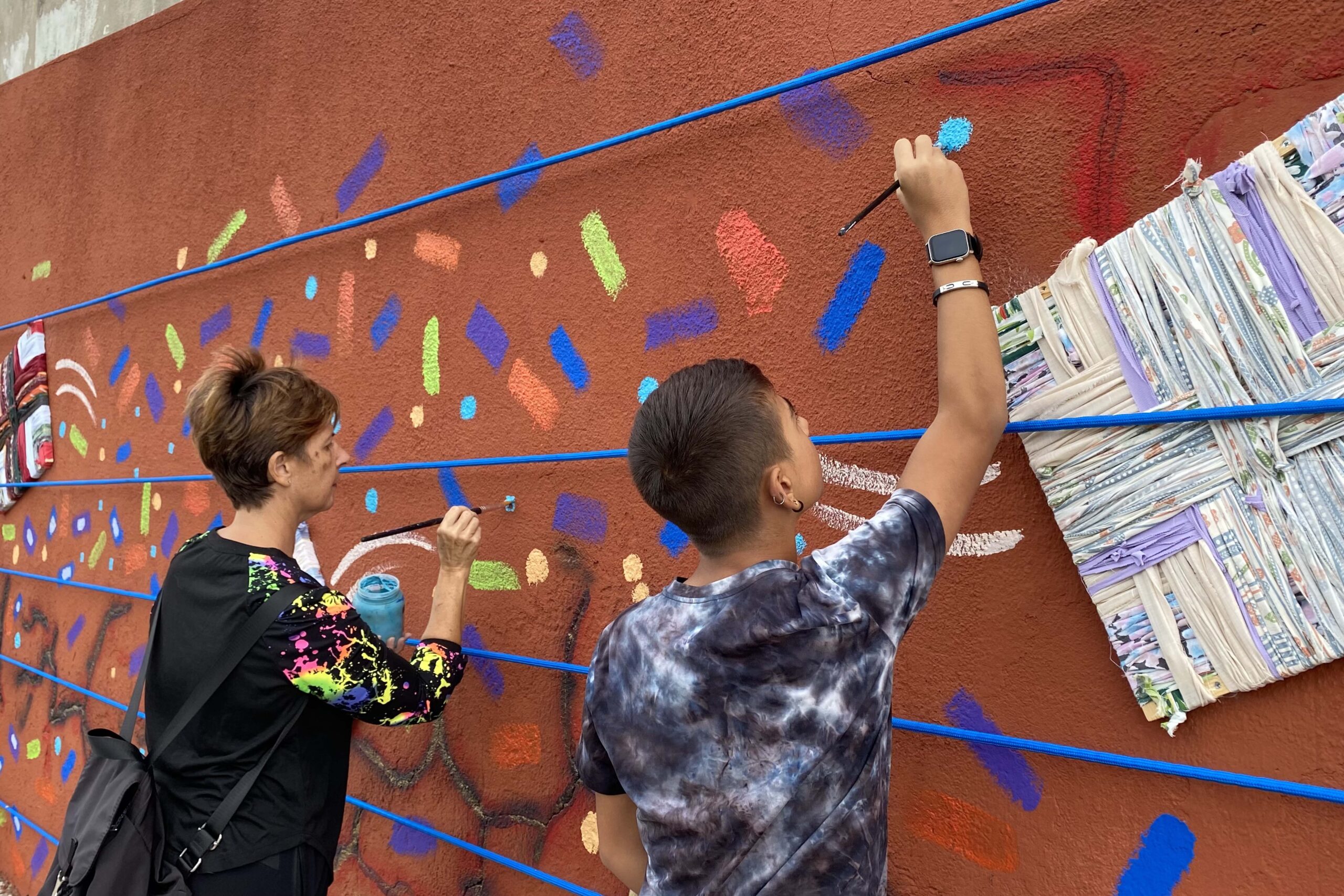 volunteers painting the wall
