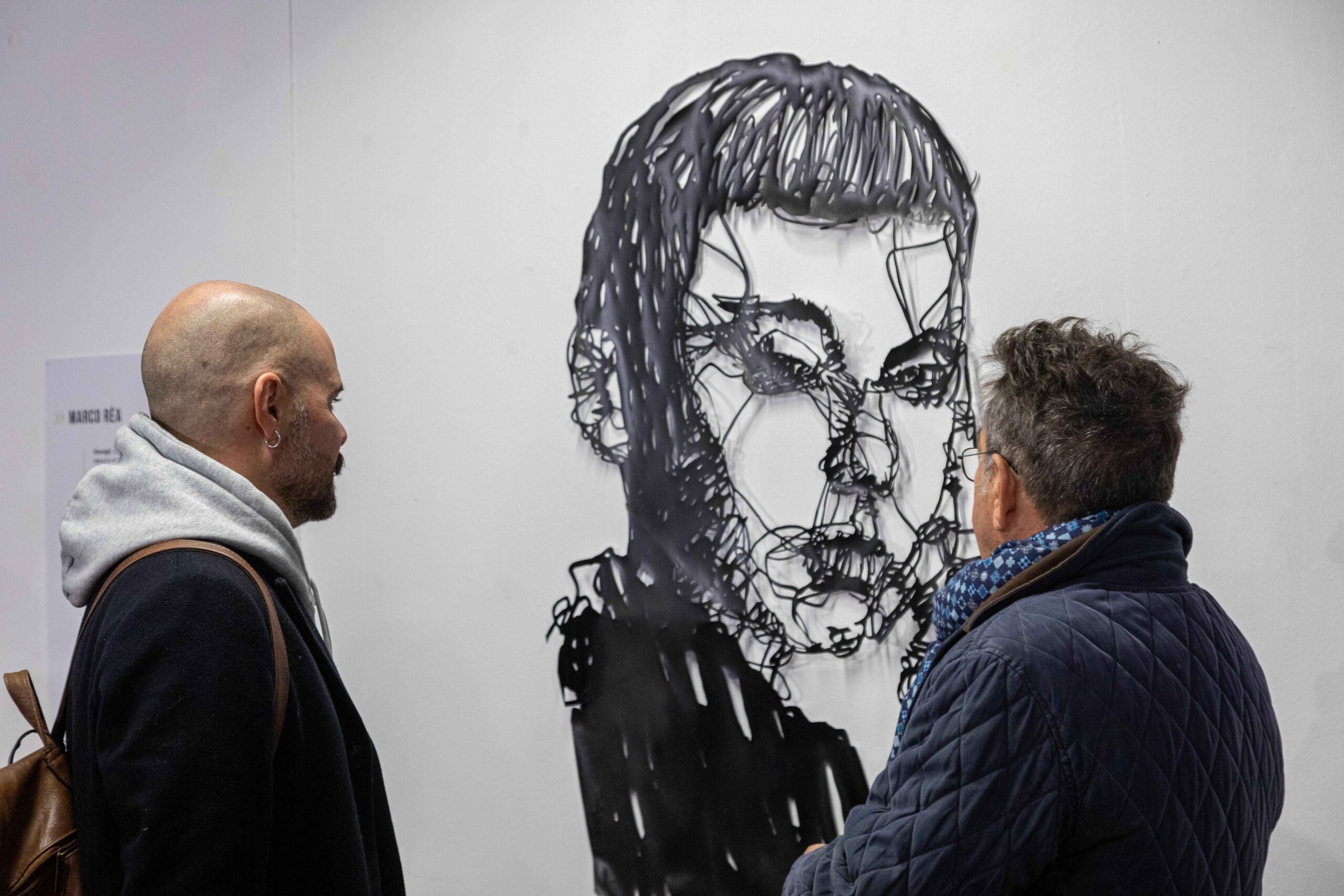 Marco Réa and Ercole Bartoli looking at Réa stencil at Bucolica Urbana opening - Photo: Massimiliano Frau